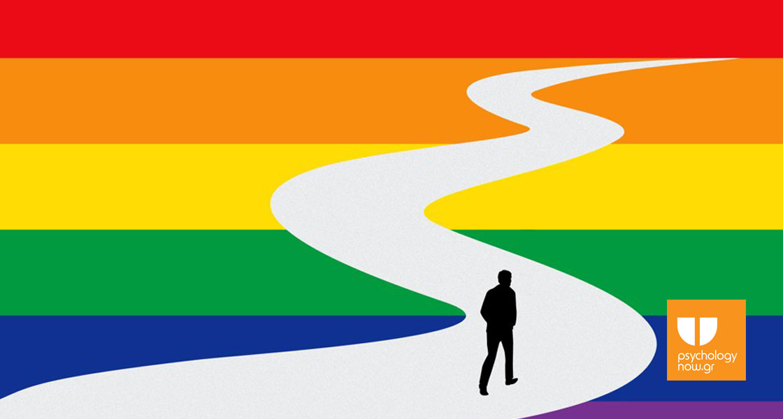 φιγούρα άνδρα που προχωράει μέσα από τα χρώματα LGBT